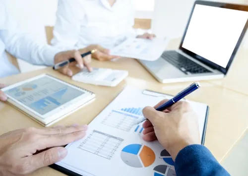 A business person reviewing sales and financial reports